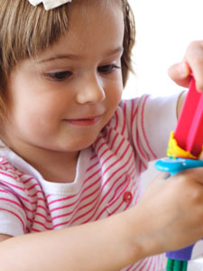 Colourful therapy play materials on a table.